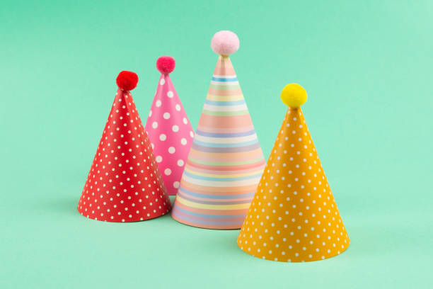 istock Colorful birthday caps on mint background. 1216224751