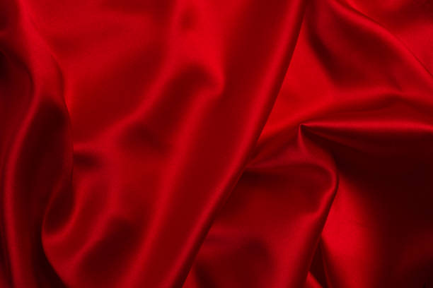 istock Red silk or satin luxury fabric texture can use as abstract background. 1216224778
