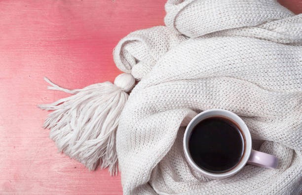istock Cup of coffee wrapped in a scarf 1216226845