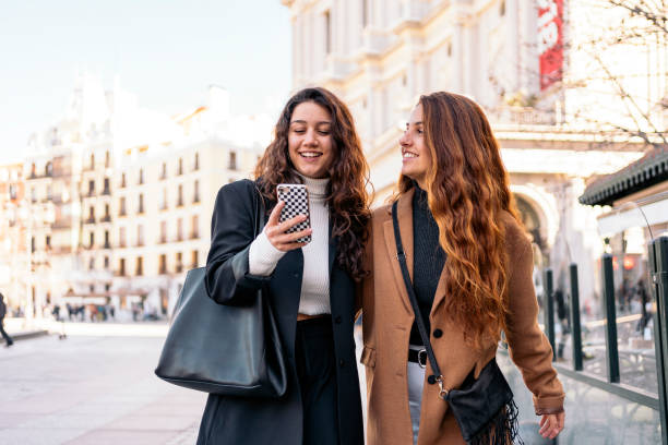 istock Two caucasian women with a smartphone 1216228692
