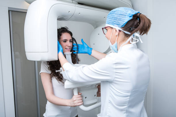 istock Dentist making X ray scan of young woman teeth 1216228989