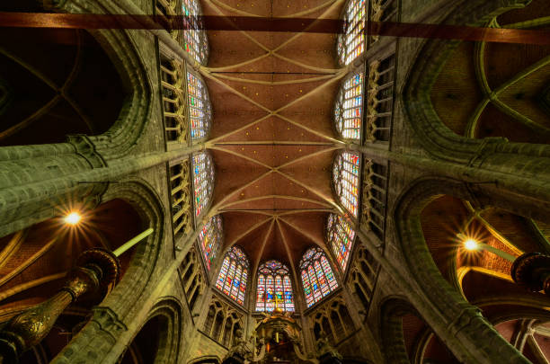 Ghent, Belgium, August 2019. Interior view of the Cathedral of San Bavo. We are impressed by the height and the slender lines of the pointed arch vaults. Red bricks.