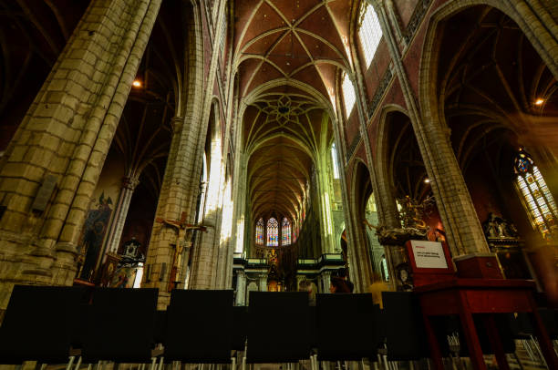 Ghent, Belgium, August 2019. Interior view of the Cathedral of San Bavo. We are impressed by the height and the slender lines of the pointed arch vaults. Red bricks.