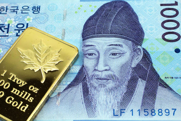 A macro image of a blue Korean 1000 won with a gold bar.  Shot close up.