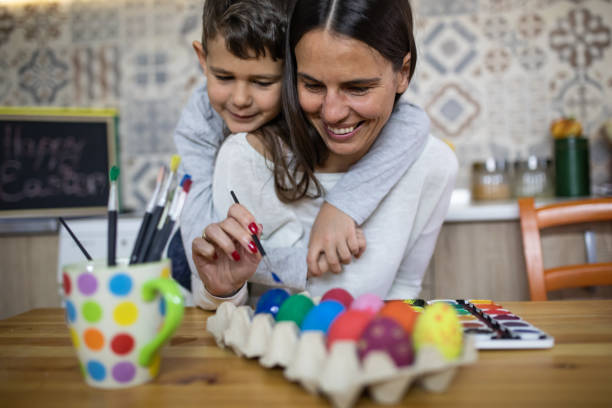 istock Mom and son Easter egg decoration stock photo 1216231577