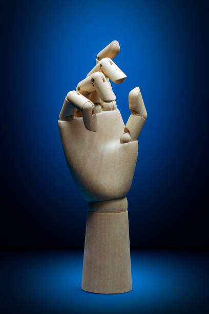 istock One wooden hand on a trending classic blue. AI 1216231959