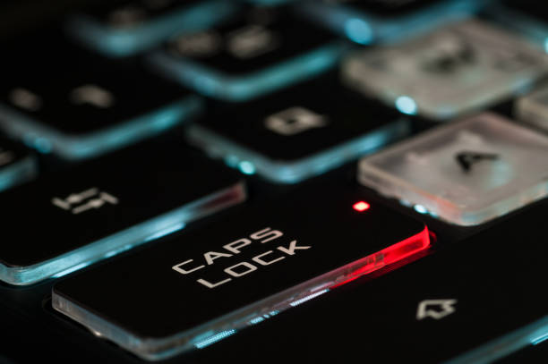 istock The Caps lock key on a backlit keyboard. The red illuminated dot on the key indicates that the capslock is turned on. 1216232901