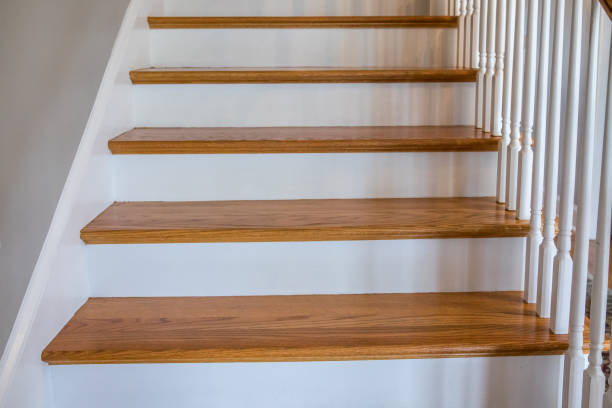 istock light-colored and white painted hardwood stairs stairway in a modern updated new construction home with a white banister 1216232931
