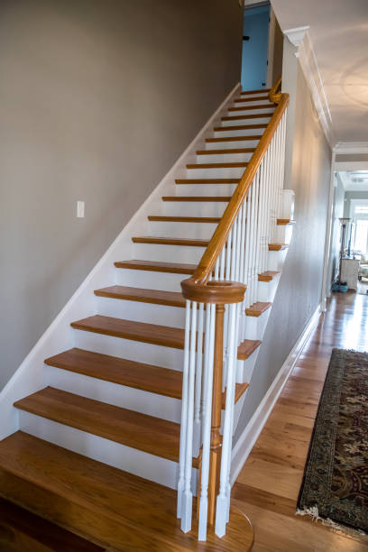 istock light-colored and white painted hardwood stairs stairway in a modern updated new construction home with a white banister 1216232934