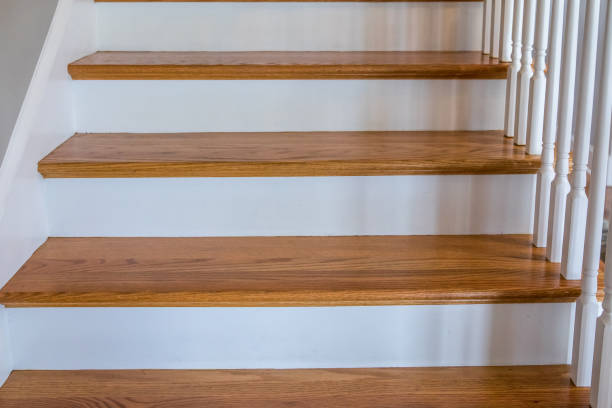istock light-colored and white painted hardwood stairs stairway in a modern updated new construction home with a white banister 1216233063