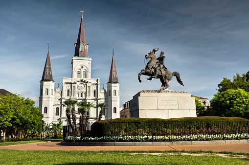 New Orleans, Louisiana - June 17, 2019:  Historic St. Louis Cathedral and the statue of Andrew Jackson across Jackson Square in New Orleans Louisiana USA