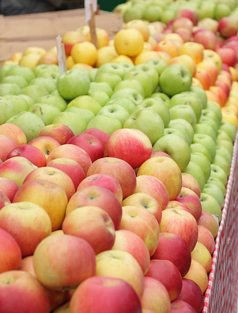 istock various apples in a market place.center focus 121623401