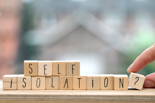 istock Wooden cubes with the word Self isolation and a question mark for Covid-19, coronavirus needs quarantine concept. 1216235123