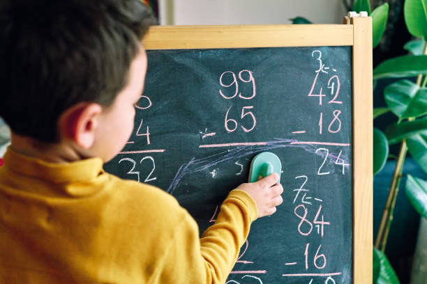 istock Education at home. 6-7 years old child learning mathematics at home. 1216236848