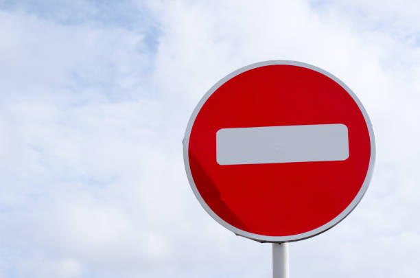 istock no entry road sign on sky background with clouds 1216240375