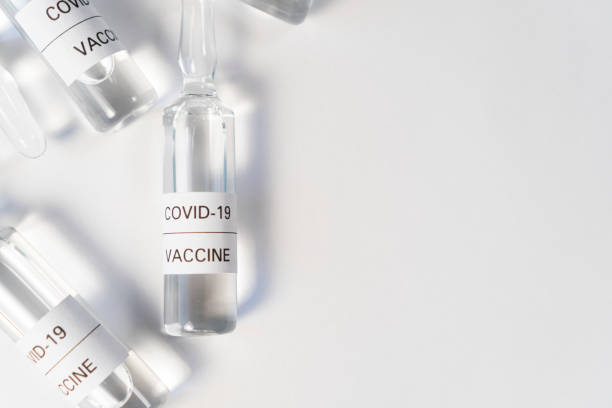 istock Ampoules with a vaccine against coronavirus, from KOVID-19 on a white table 1216241513
