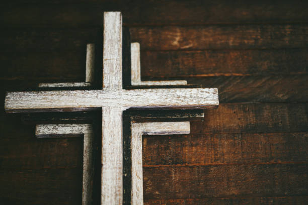 istock Wooden crosses on dark background 1216243265