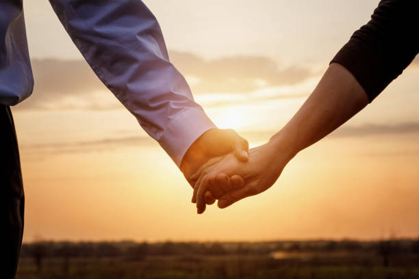 istock Couple man and woman hold hands . 1216243972