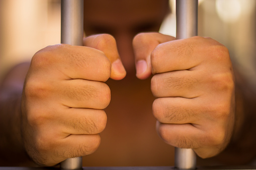 A man holding bars with his two hands
