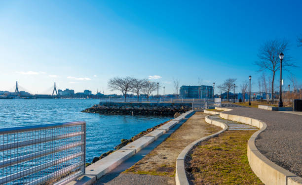 istock Curved Footpath on the Riverbank in Boston Harbor 1216245936