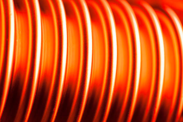 istock Glowing hot corrugated pipe of steel for heating or cooling - selective focus 1216246433
