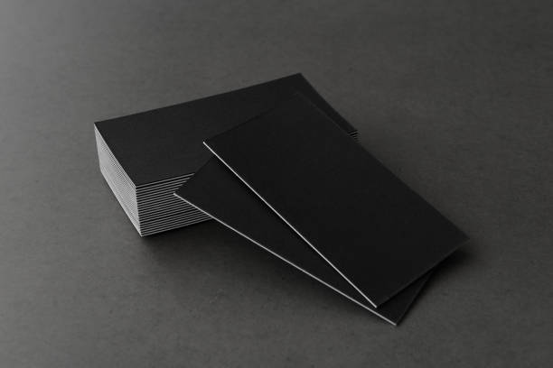 istock Business card on black background. 1216247457