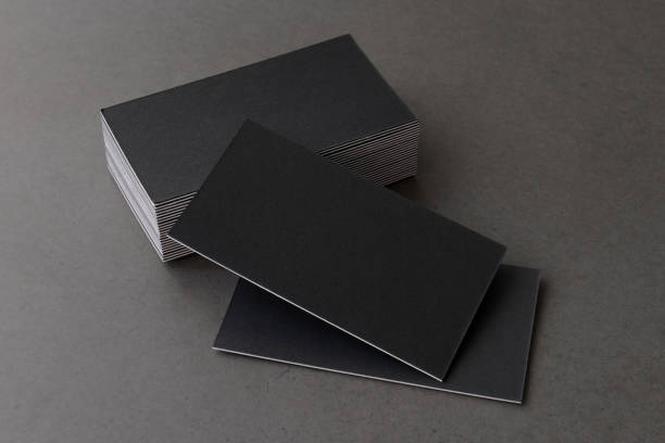 istock Business card on black background. 1216247460