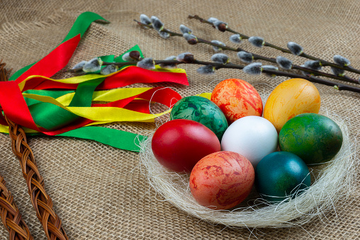Czech rod with differently colored Easter eggs and with twigs of willow catkins