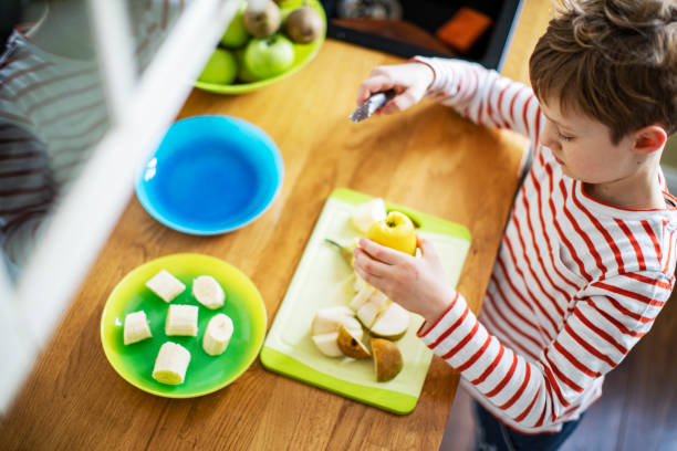 istock Little boy cooking at home 1216248805