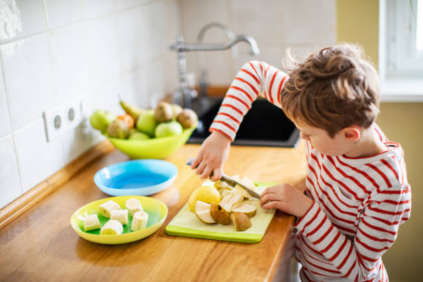 istock Little boy cooking at home 1216248815