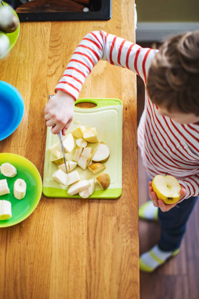 istock Little boy cooking at home 1216248833