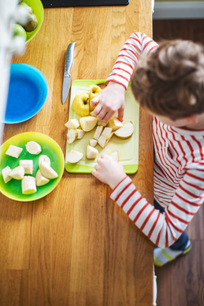 istock Little boy cooking at home 1216248855