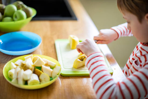 istock Little boy cooking at home 1216248908