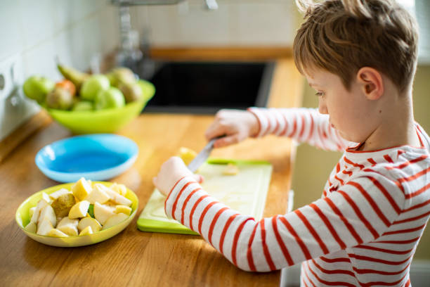istock Little boy cooking at home 1216248947