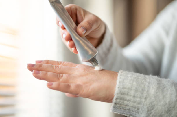istock Woman applying hand cream on her hand 1216251062