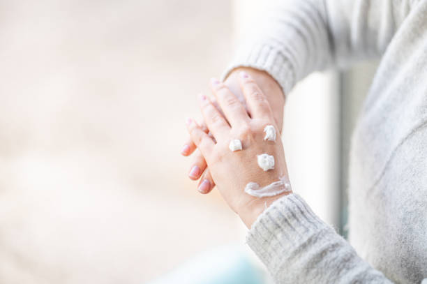 istock Smiley made with hand cream on woman's hands 1216251113