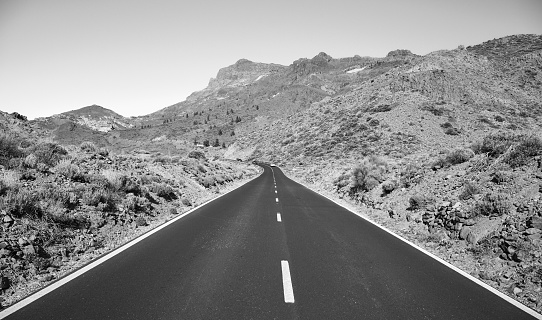 Black and white picture of a scenic road in Teide National Park, Tenerife, Spain.