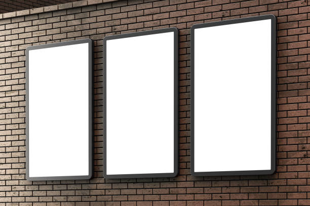 istock Group of blank lightboxes or street LCD panel on brown brick wall 1216252194