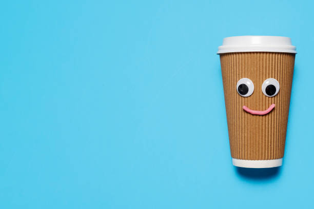 istock Happy smiling disposable coffee cup on the right 1216252345