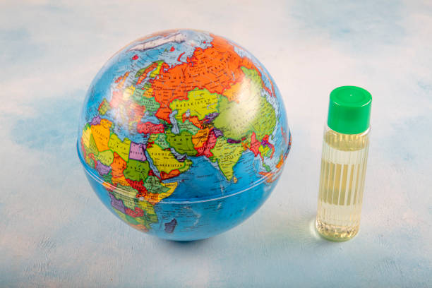 istock Globe and cologne ( kolonya ) isolated on blue background.Healthy days concept. 1216252504