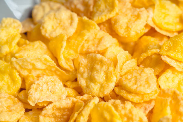 istock Tasty crispy corn flakes in bowl on the rustic background 1216252554