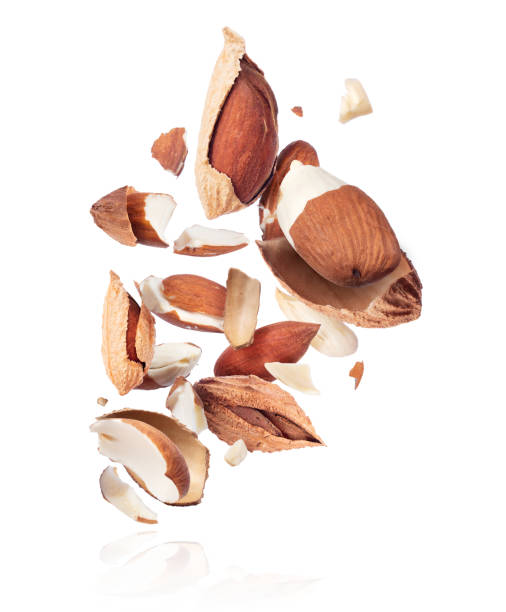 istock Crushed almonds are hanging in the air close-up on a white background 1216252629