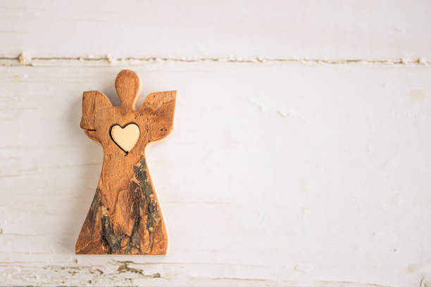 wooden angel on white background