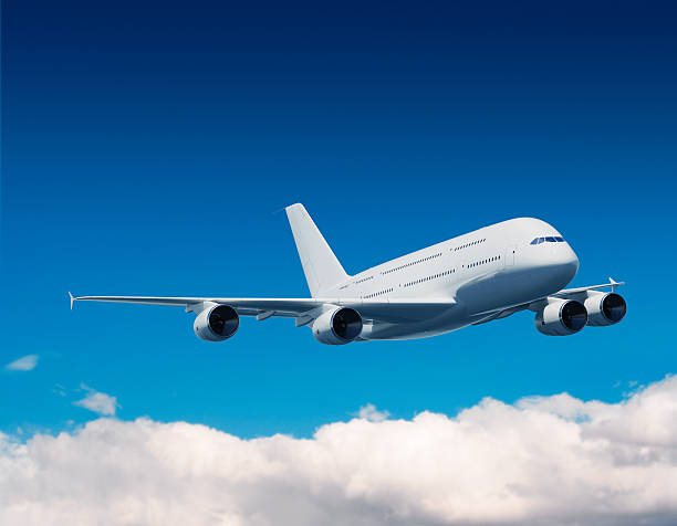 istock Airplaine in the sky with clouds 121625562