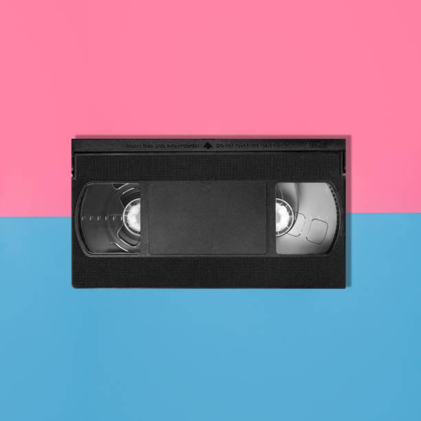 istock cassette for VCR on blue and pink background 1216256713