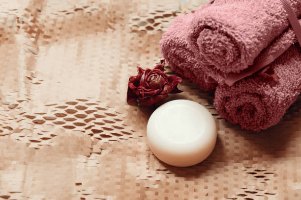 istock Bars of soap with bath salt and towels 1216257700