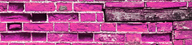 istock Pink, long brick wall, as a background texture for design - in panorama / header / banner. 1216259241