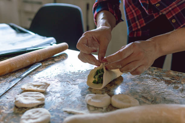 istock Woman cooking at home 1216259817