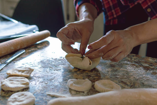 istock Woman cooking at home 1216260393