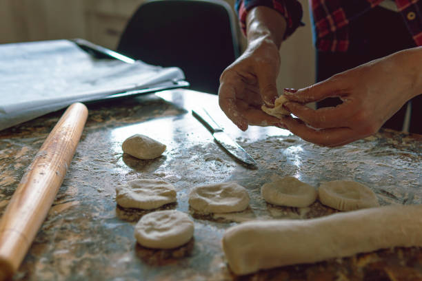 istock Woman cooking at home 1216260493
